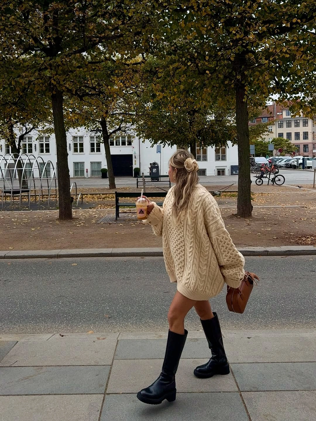 Oversized cream knit with dark knee high footwear