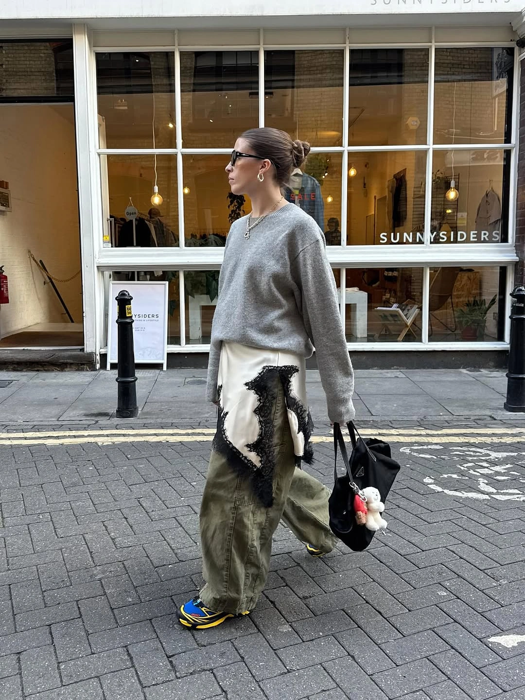 Gray sweater olive wide trousers and bright sneakers