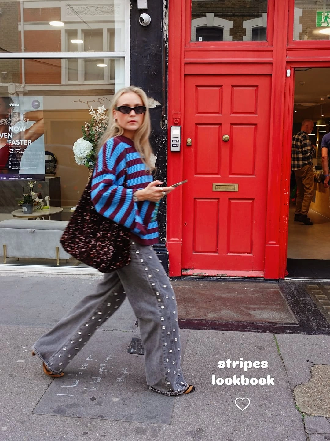 Striped sweater gray wide trousers black tote and pink shoes