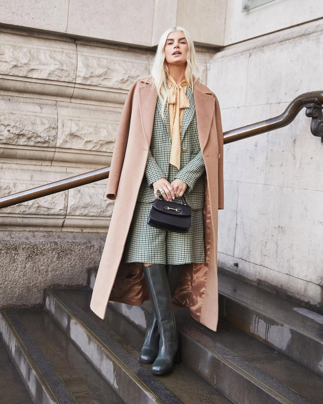 Long blush coat with sage layers and wide trousers