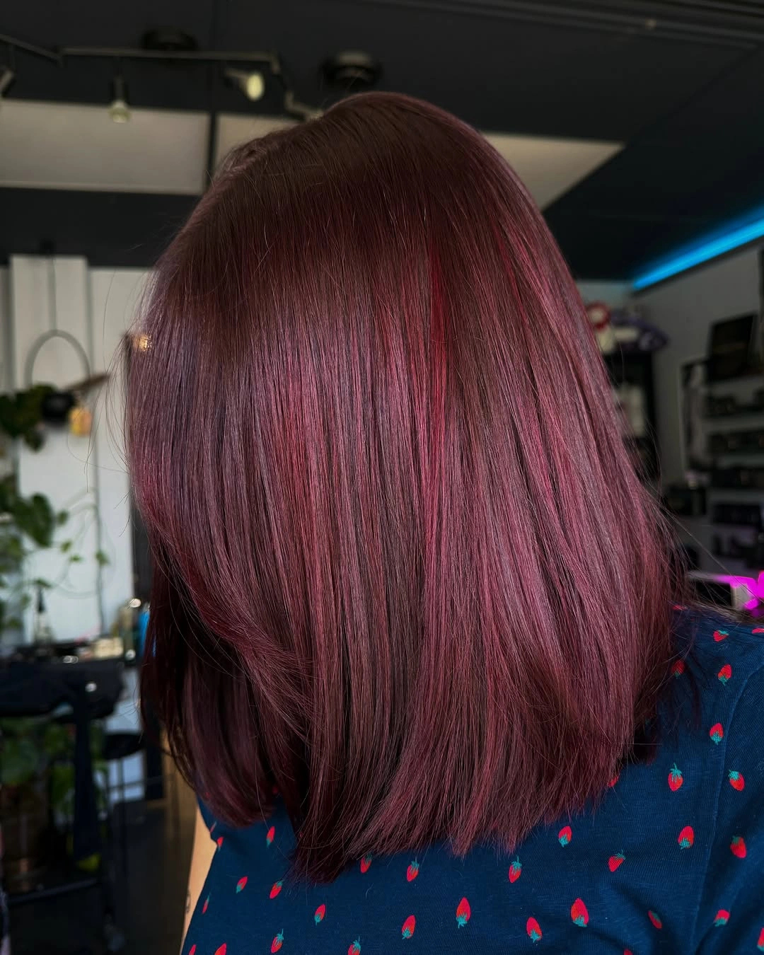 Smooth shoulder length plum mauve bob