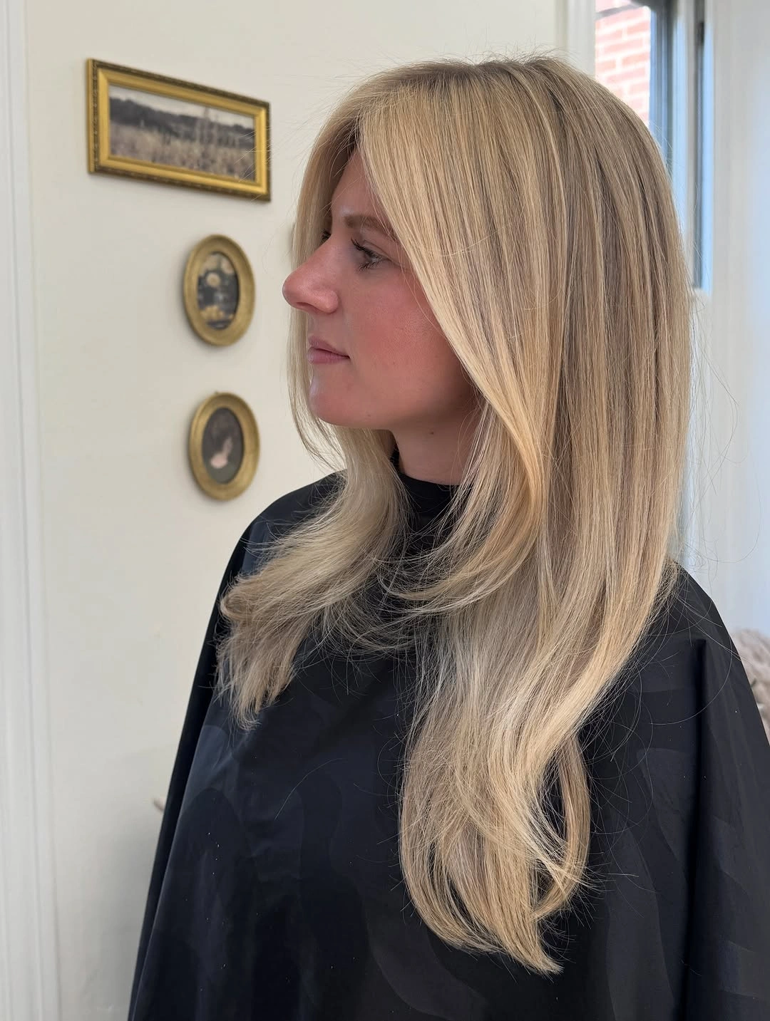 Long light blonde layers with soft face framing