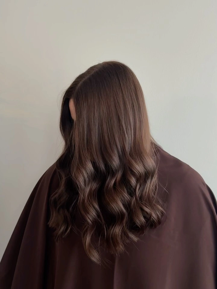 Long dark chocolate hair with soft waves