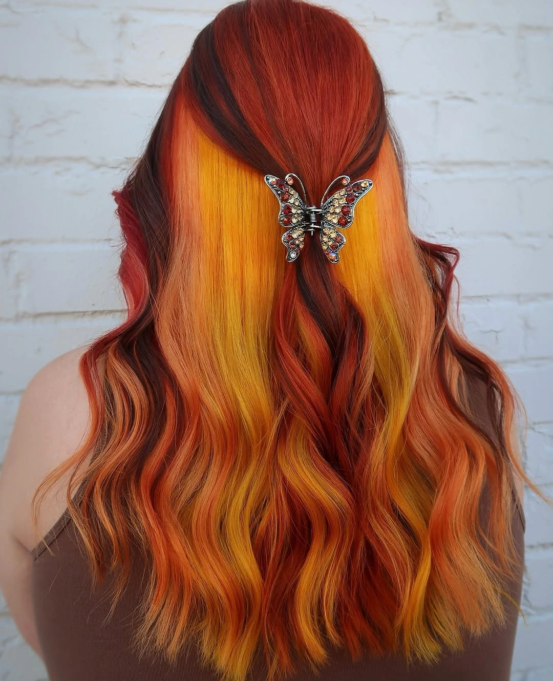 Bright copper waves with a butterfly half up clip
