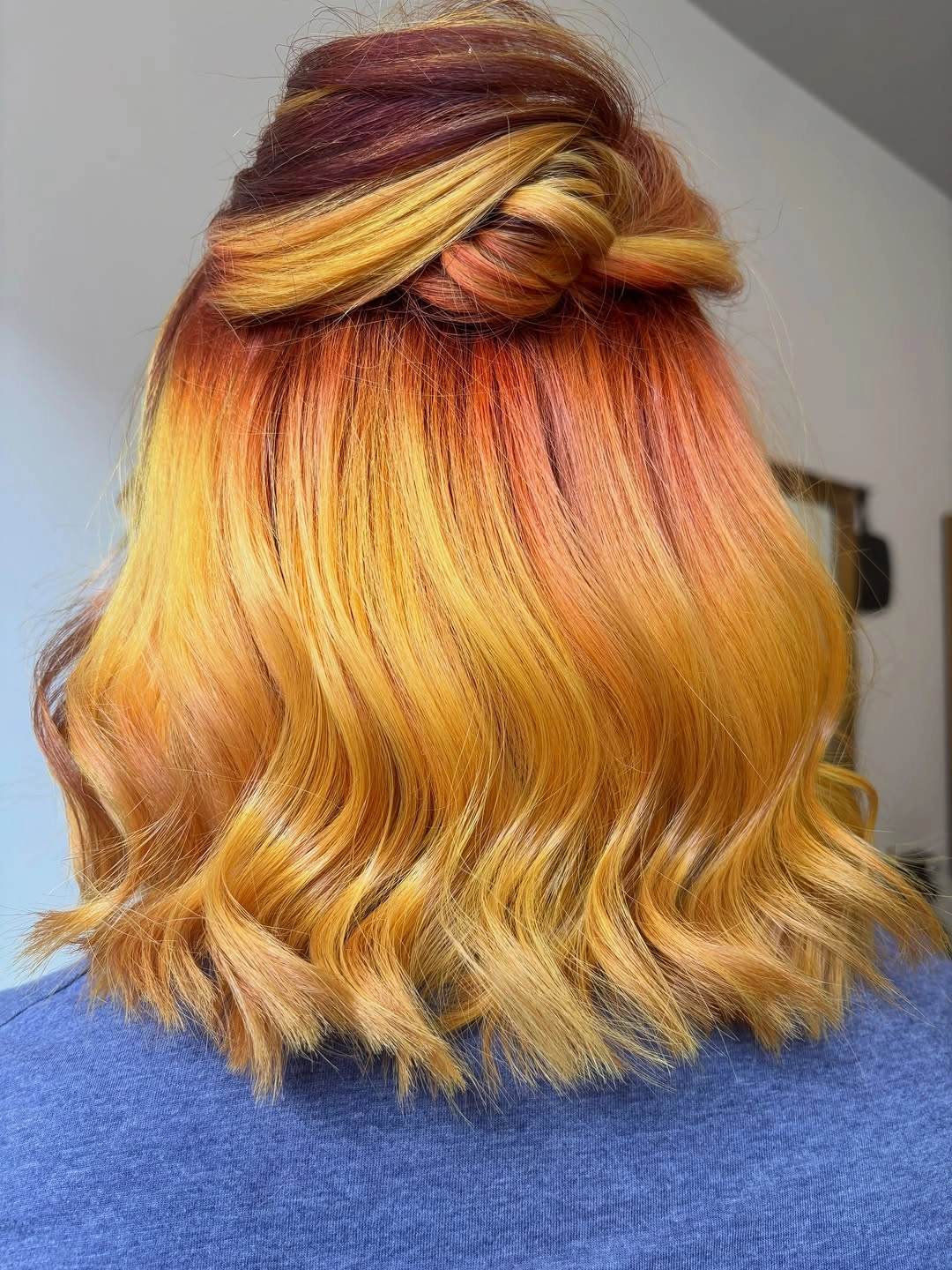 Golden blonde waves with a half-up crown