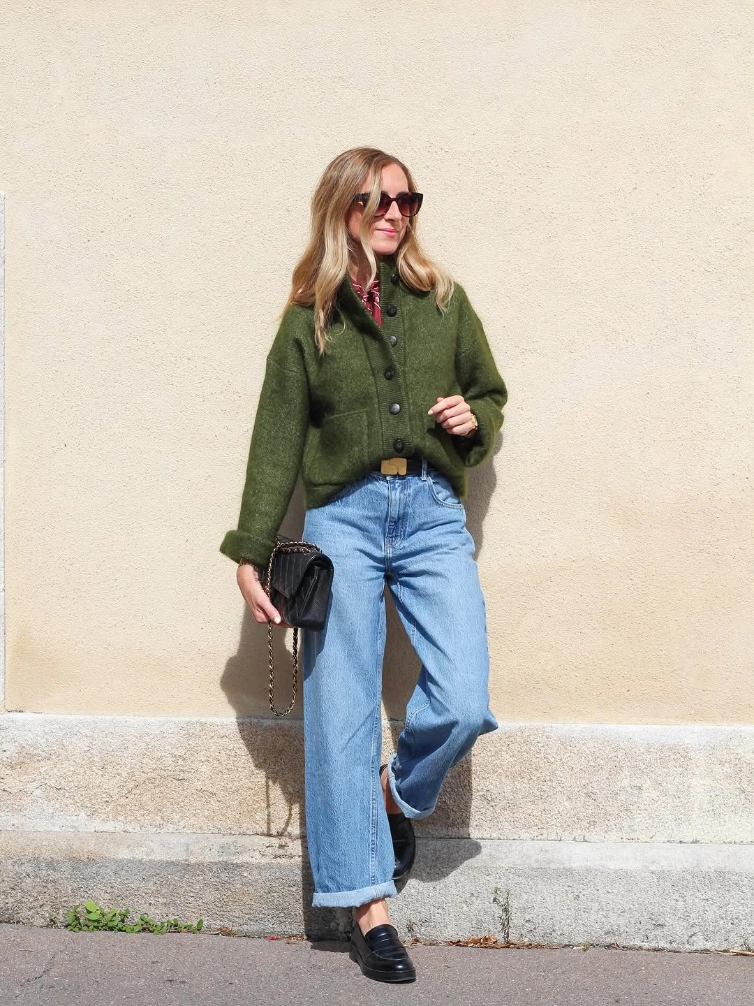 Muted green layer with light blue jeans and loafers