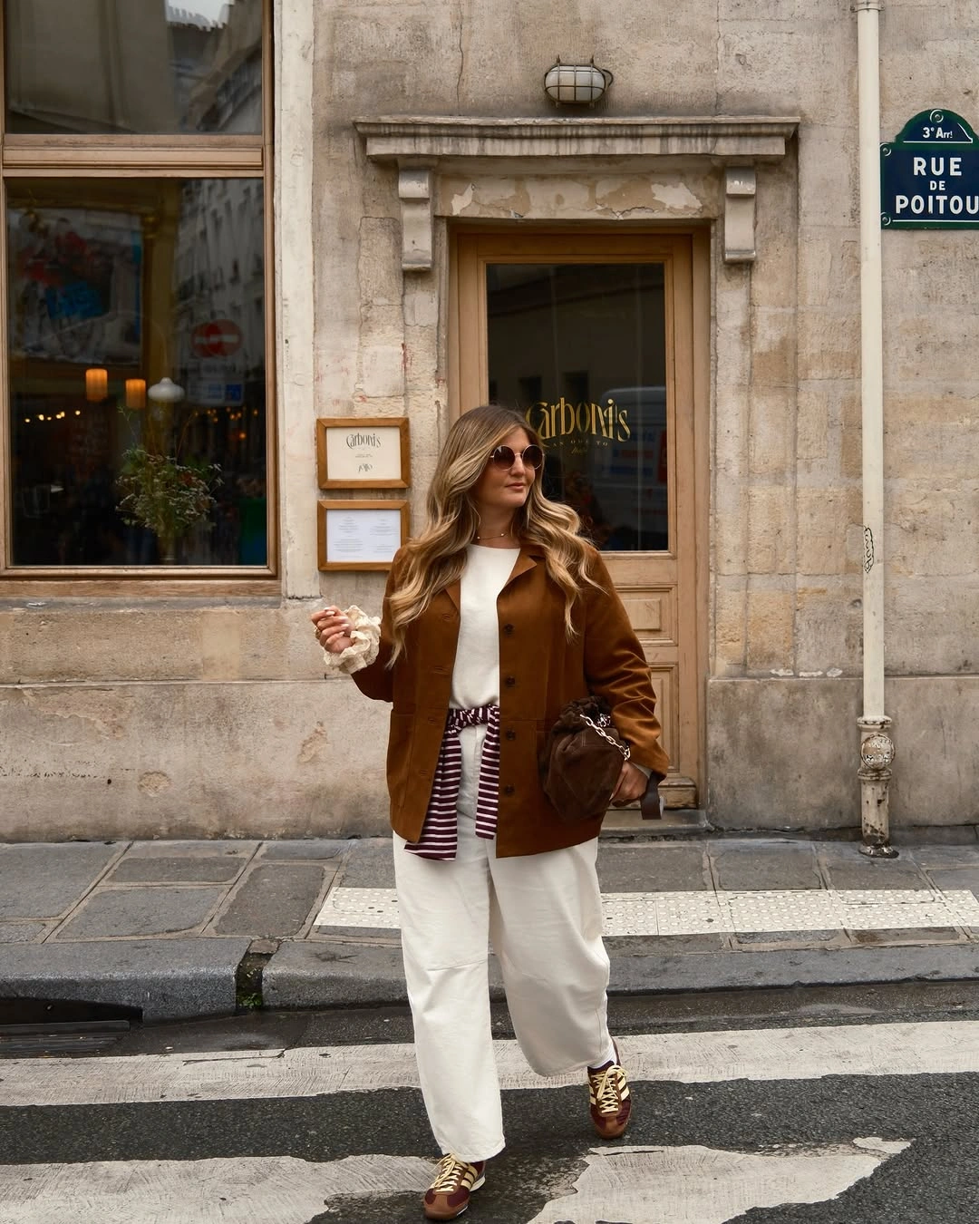 Brown jacket with white wide trousers and loafers