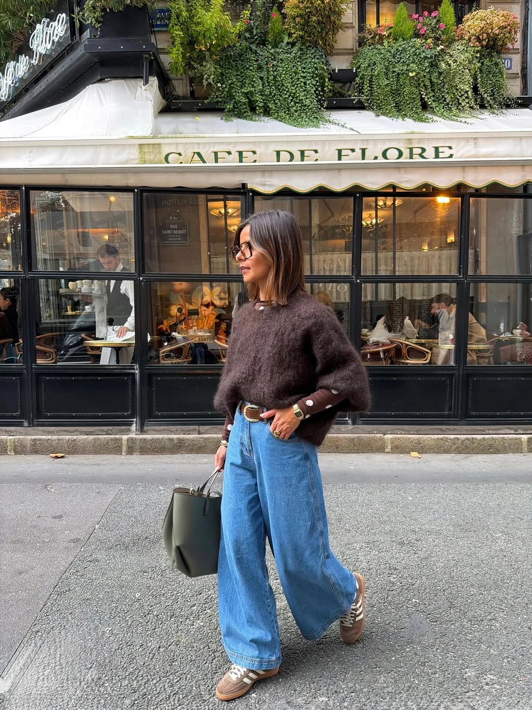 Dark sweater wide jeans and muted green bag