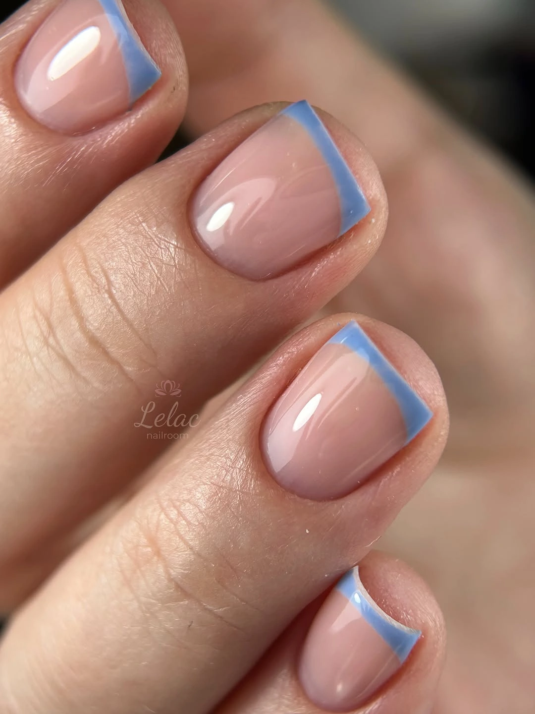 short peach nude nails with pale blue micro French tips