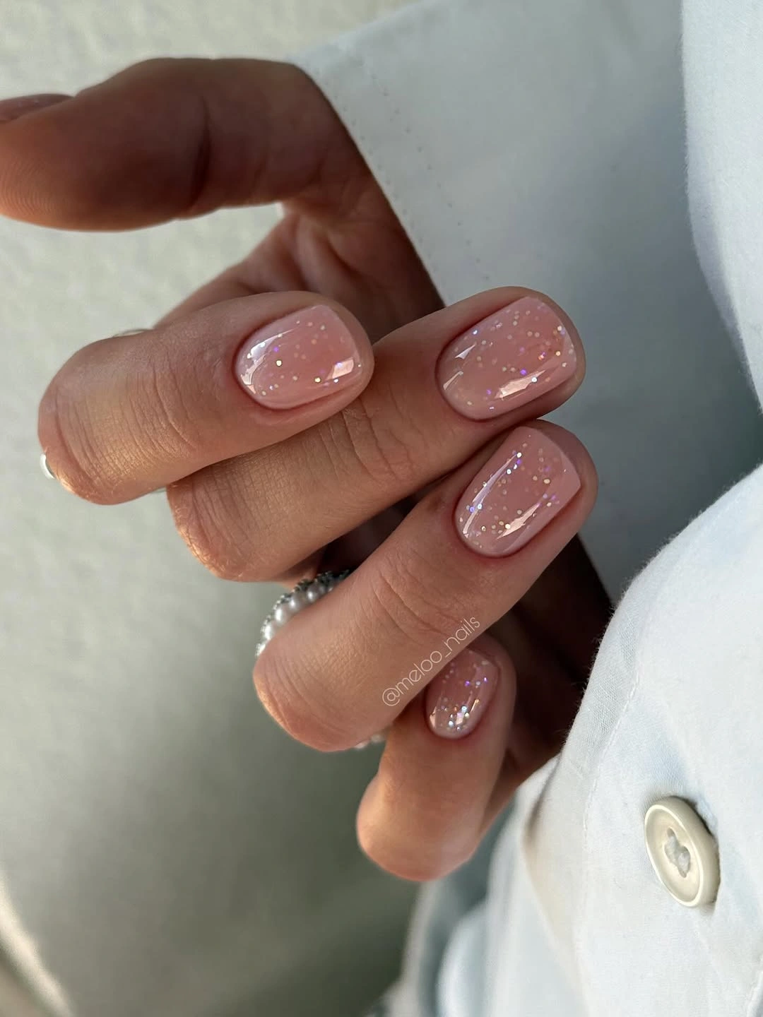 short pink square nails with pearly shimmer and subtle flecks