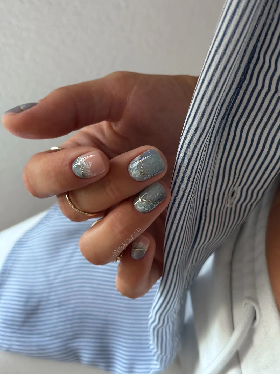 short slate blue gray nails with silver glitter accents