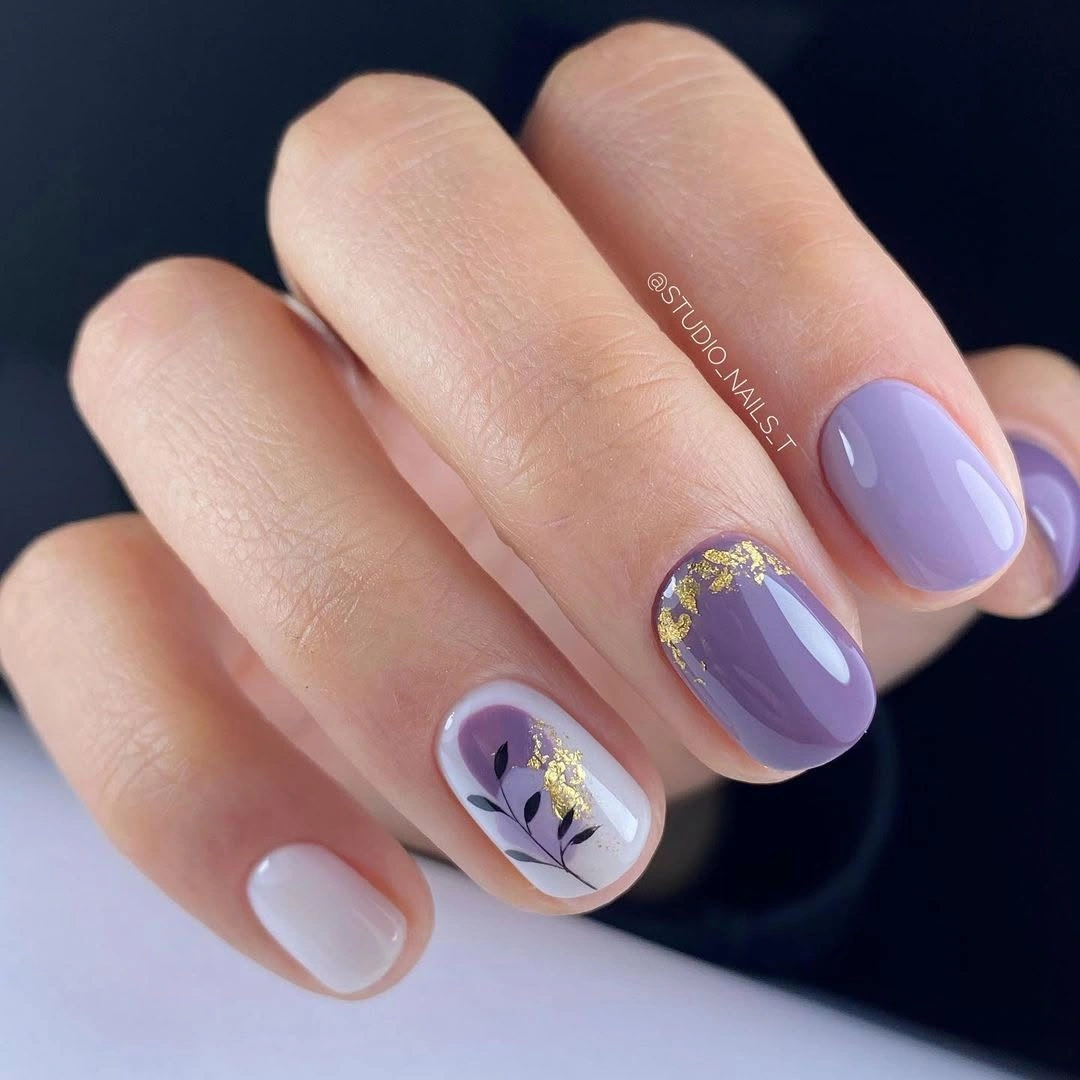 short pastel nails with lavender pink and a tiny floral accent