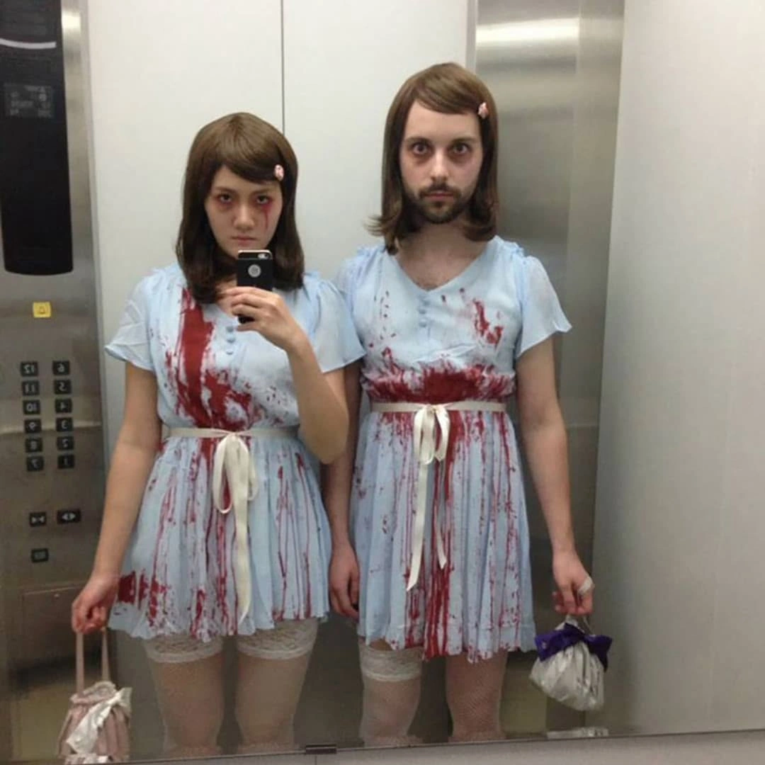 Matching distressed white dresses with red stain effects ragged hems and white footwear
