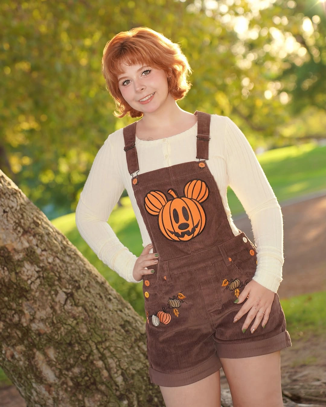 Brown pumpkin-patch overalls over cream top with brown boots