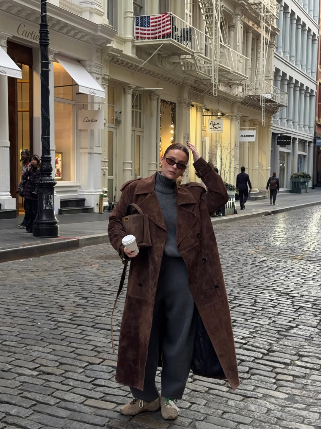 Brown Suede Trench Coat Over Grey Knitwear for a Relaxed Journey — Winter Travel Outfits