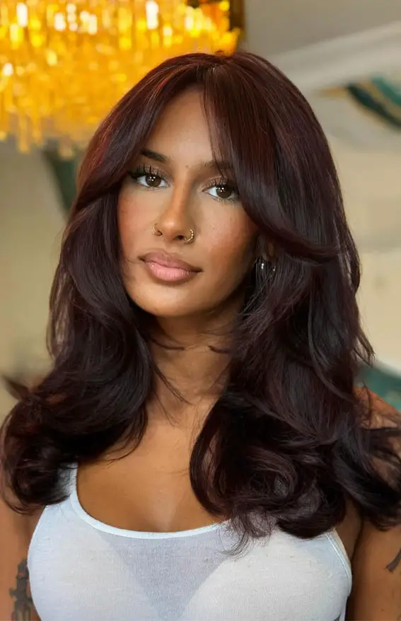 Velvety Plum Layers With Curtain Bangs Velvety Plum Layers With Curtain Bangs — Winter Haircuts with Bangs