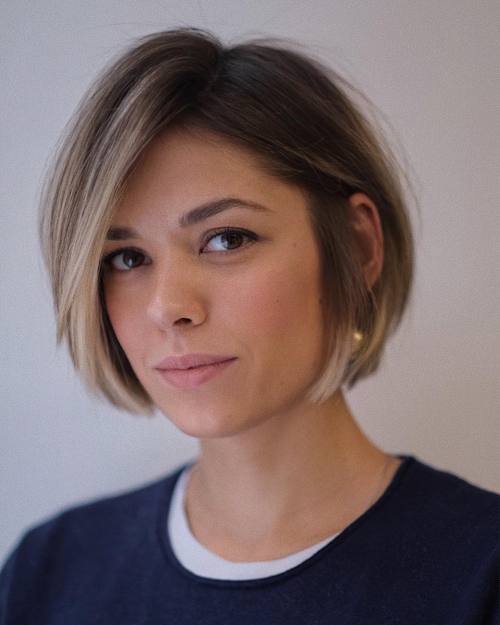Sleek Ear-Length Bob With Side Bangs Sleek Ear-Length Bob With Side Bangs — Winter Haircuts for Heart Shaped Faces