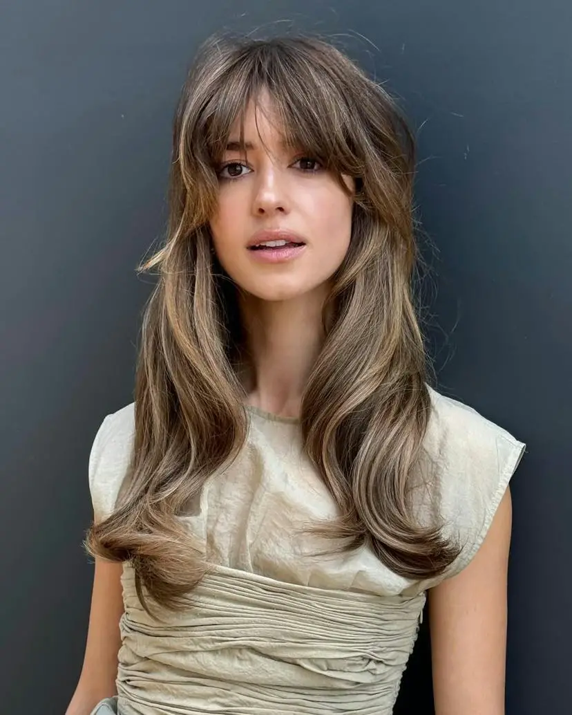 Collarbone Shag With Honey Highlights Collarbone Shag With Honey Highlights — Winter Haircuts for Wavy Hair
