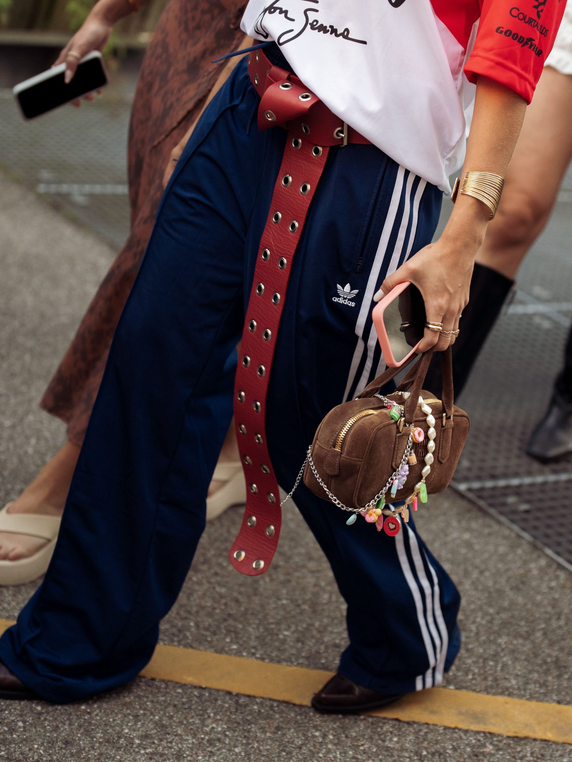 Navy Track Pants with Red Belt and Suede Handbag Navy Track Pants with Red Belt and Suede Handbag — Sweatpants Outfits