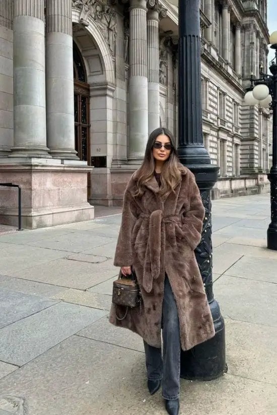 Brown Faux Fur Coat and Straight-Leg Jeans for a Stylish Journey — Winter Travel Outfits