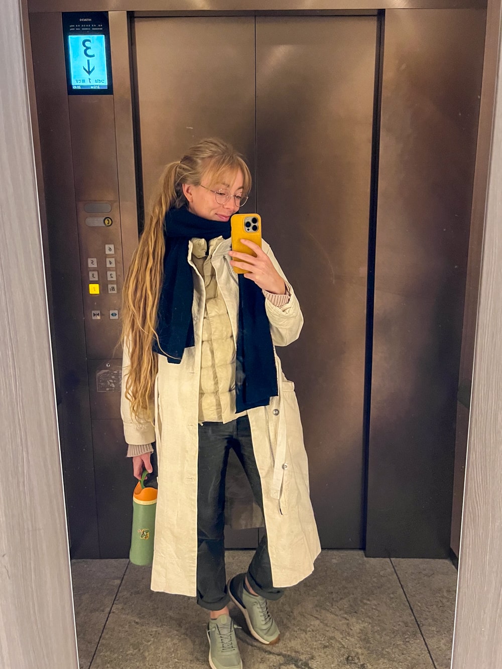 Cozy Chic: Beige Trench Coat and Quilted Vest Combination — Japan Winter Outfits