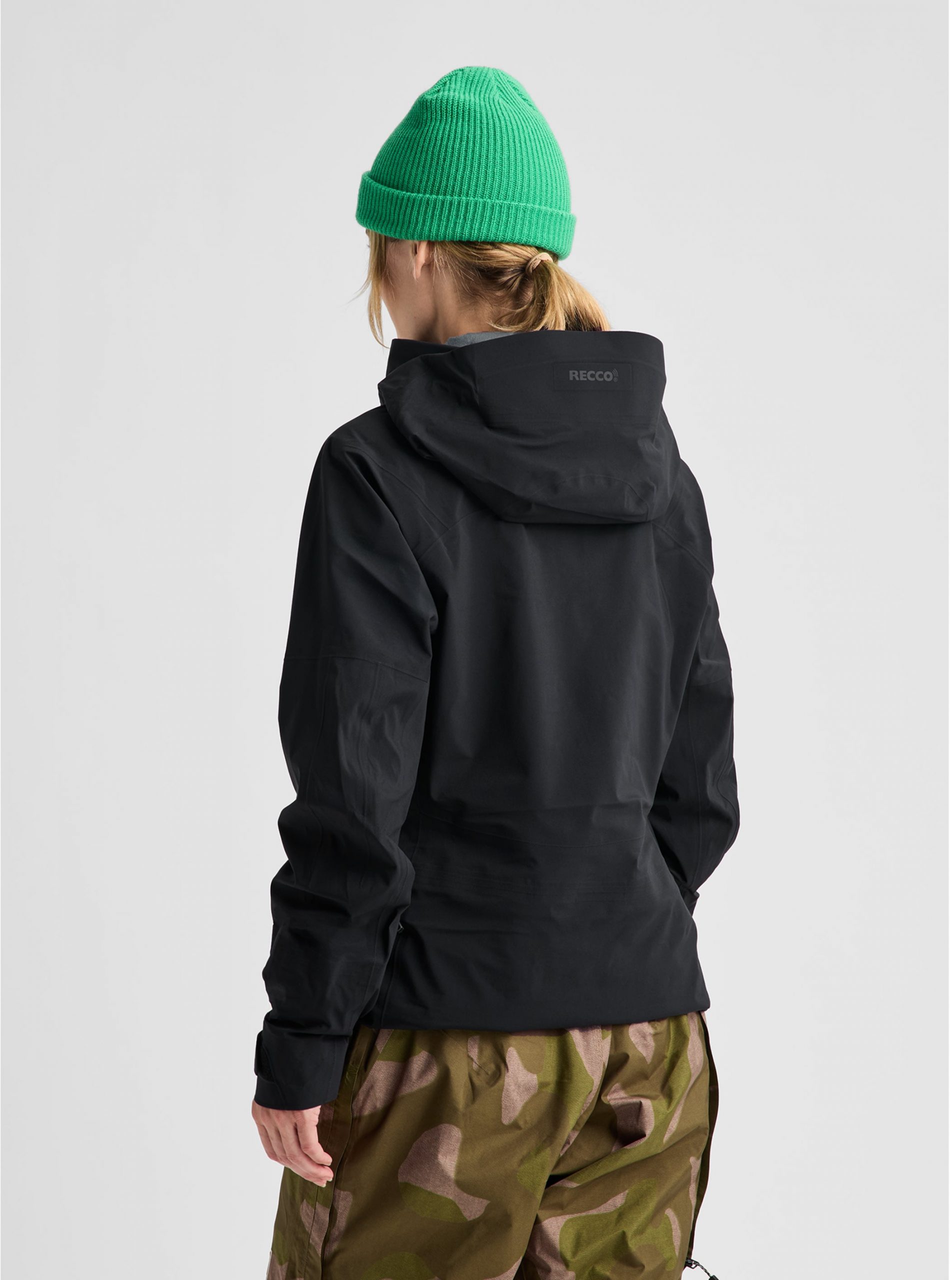 Black Snowboard Jacket with Camouflage Pants and Green Beanie Black Snowboard Jacket with Camouflage Pants and Green Beanie — Snowboarding Outfits