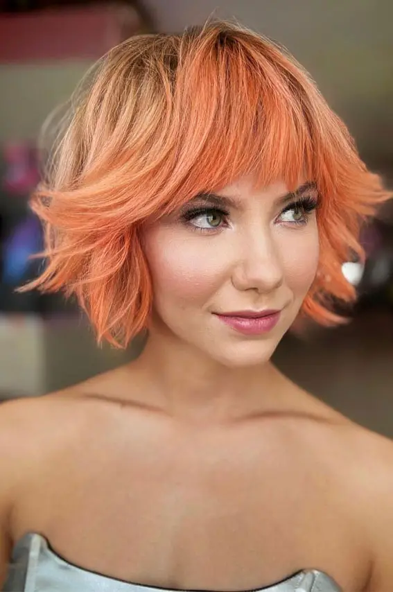 Vibrant Coral Orange Shaggy Bob Vibrant Coral Orange Shaggy Bob — Winter Hair Colors for Short Hair