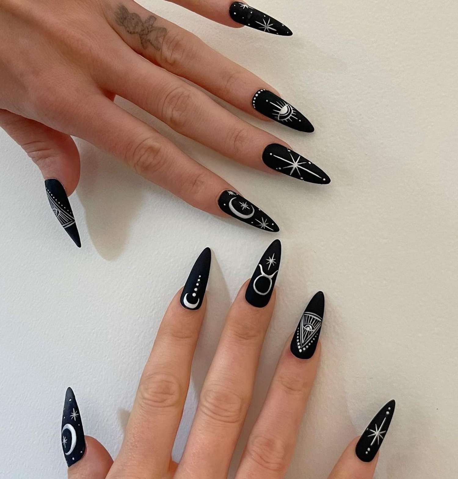 Matte Black Celestial Motif Stilettos Matte Black Celestial Motif Stilettos — Winter Black Nails