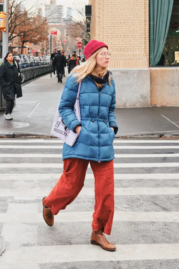 Vibrant Blue Puffer Jacket Paired with Orange Corduroy Pants Vibrant Blue Puffer Jacket Paired with Orange Corduroy Pants — NYC Winter Outfits
