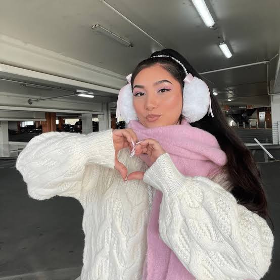 Feminine White Earmuffs with Pink Bows and Cable-Knit Sweater Feminine White Earmuffs with Pink Bows and Cable-Knit Sweater — Earmuffs Outfits