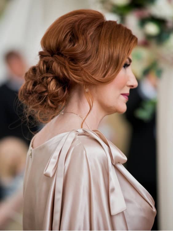 Red Side Chignon With Soft Waves — Winter Updos