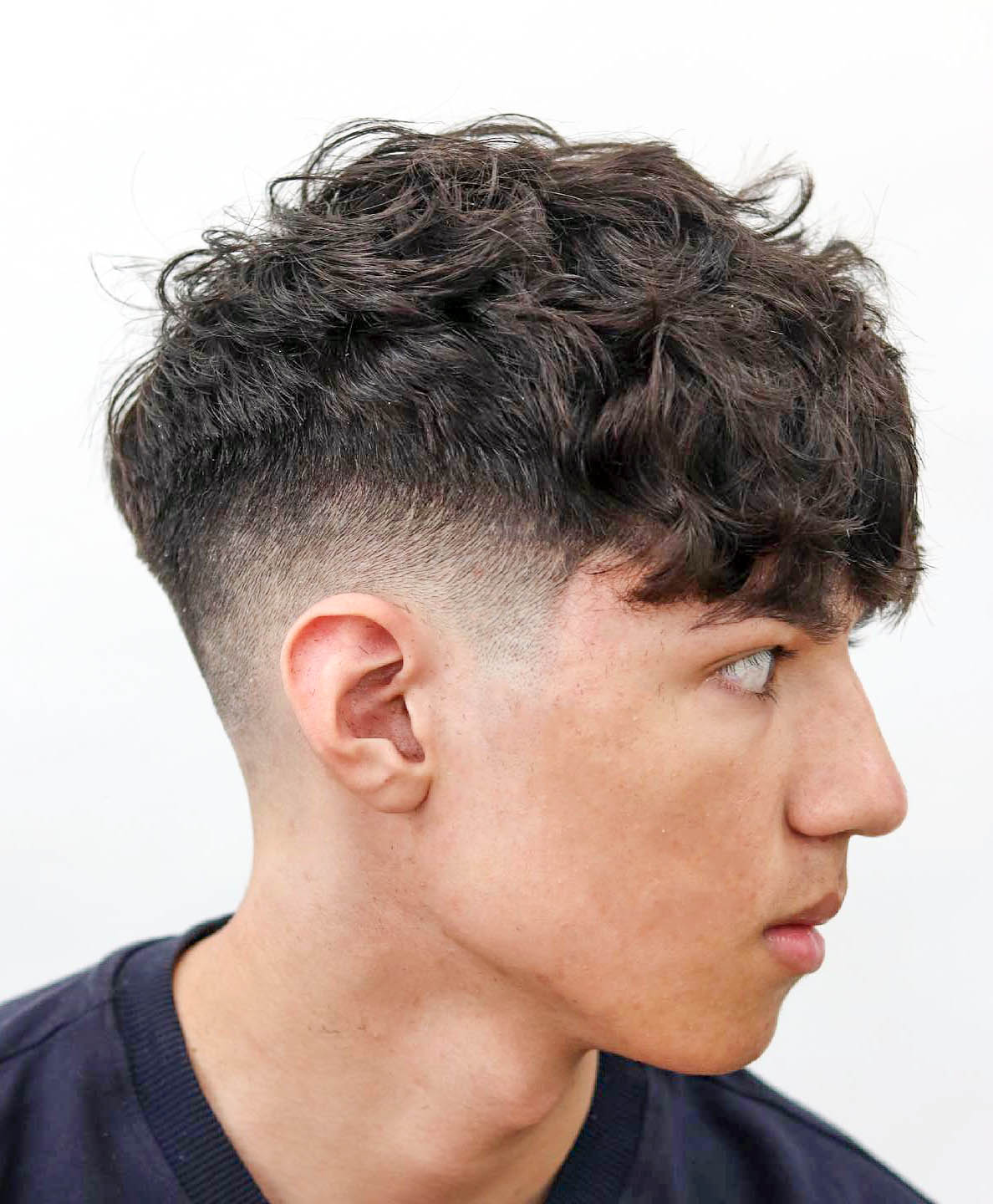 Short On Sides Longer On Top Textured Crop With Long Curly Fringe Short On Sides Longer On Top Textured Crop With Long Curly Fringe — Winter Haircuts for Boys