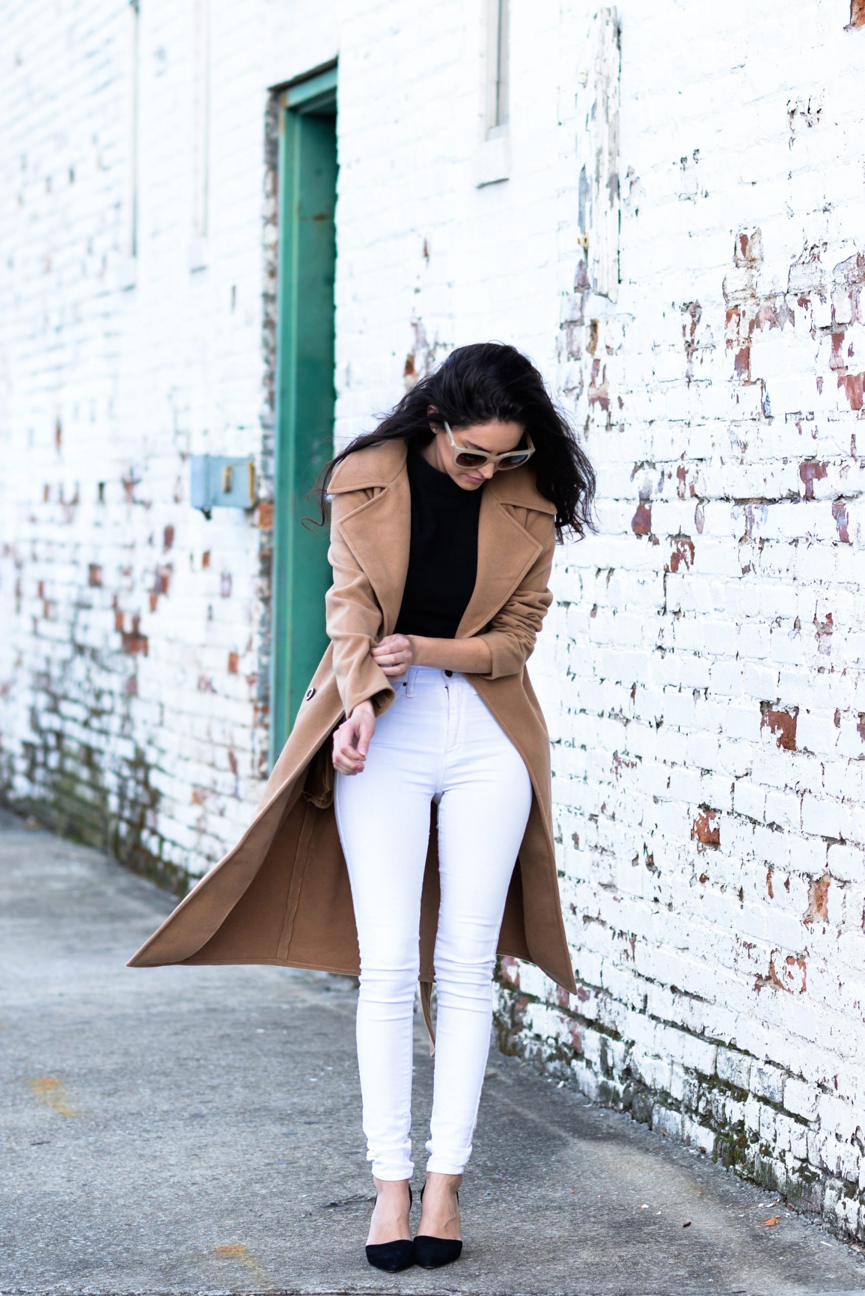 Camel Wool Coat Over Black Top and White Skinny Jeans — Neutral Winter Outfits