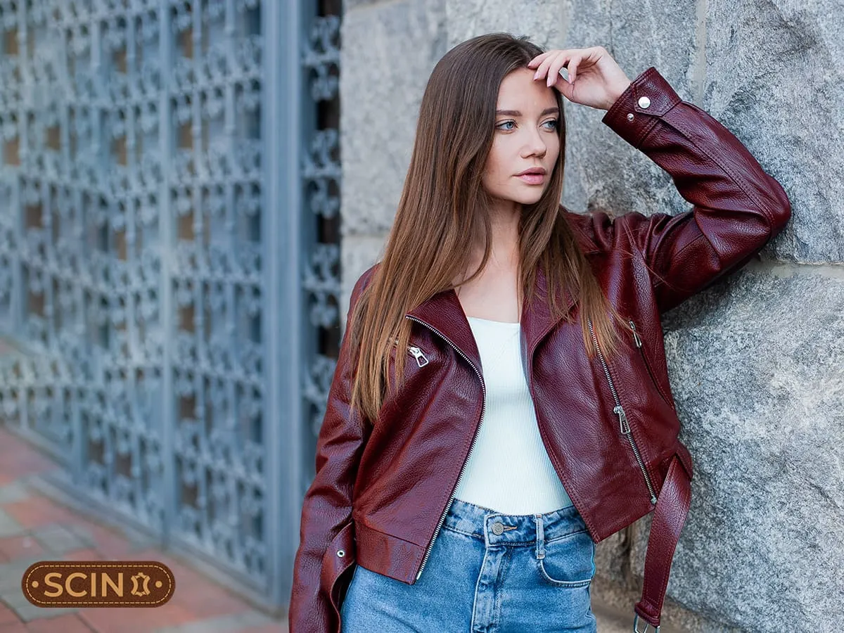 Classic Burgundy Leather Moto Jacket Over a White Top and Blue Jeans Classic Burgundy Leather Moto Jacket Over a White Top and Blue Jeans — Burgundy Outfits