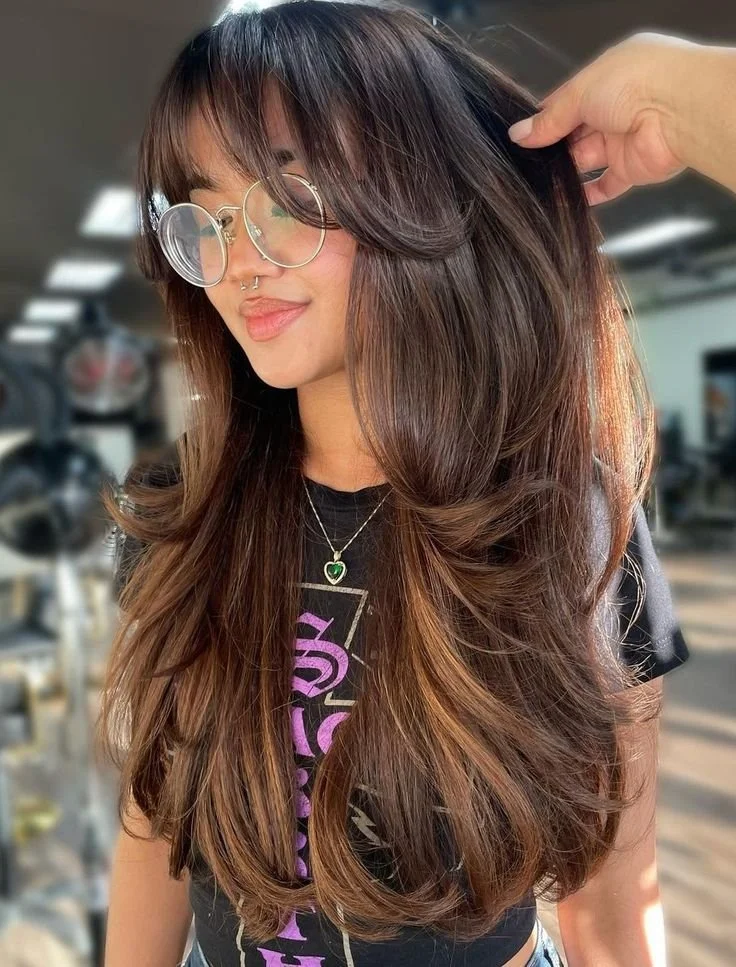 Mid-Back Layers With Caramel Highlights Mid-Back Layers With Caramel Highlights — Winter Haircuts with Bangs