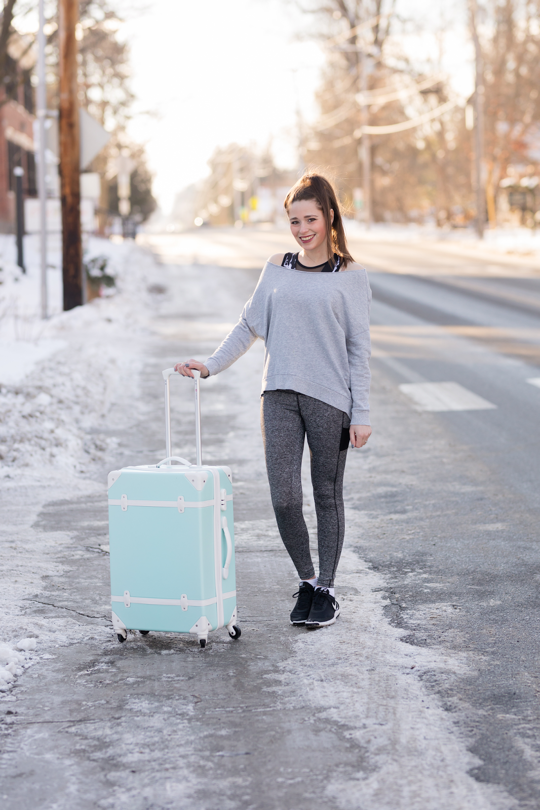 Grey Long-Sleeve Top and Fitted Leggings with Snowy Backdrop Grey Long-Sleeve Top and Fitted Leggings with Snowy Backdrop — Winter Airport Outfits