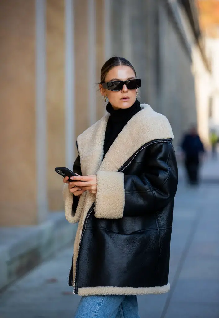Oversized Black Leather Shearling Jacket with Blue Denim — Shearling Coat Outfits