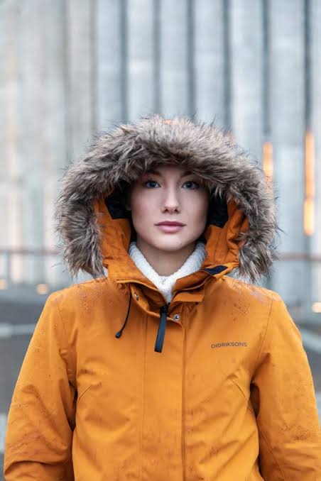 Vibrant Orange Parka with Plush Fur Hood Vibrant Orange Parka with Plush Fur Hood — Iceland Winter Outfits