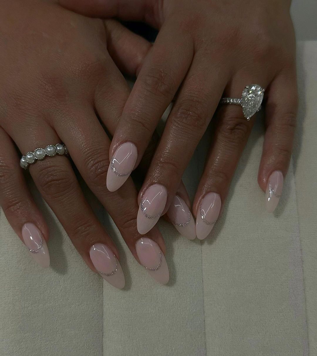 Sheer Pink Glitter Crescent Lines Sheer Pink Glitter Crescent Lines — Short Winter Almond Nails