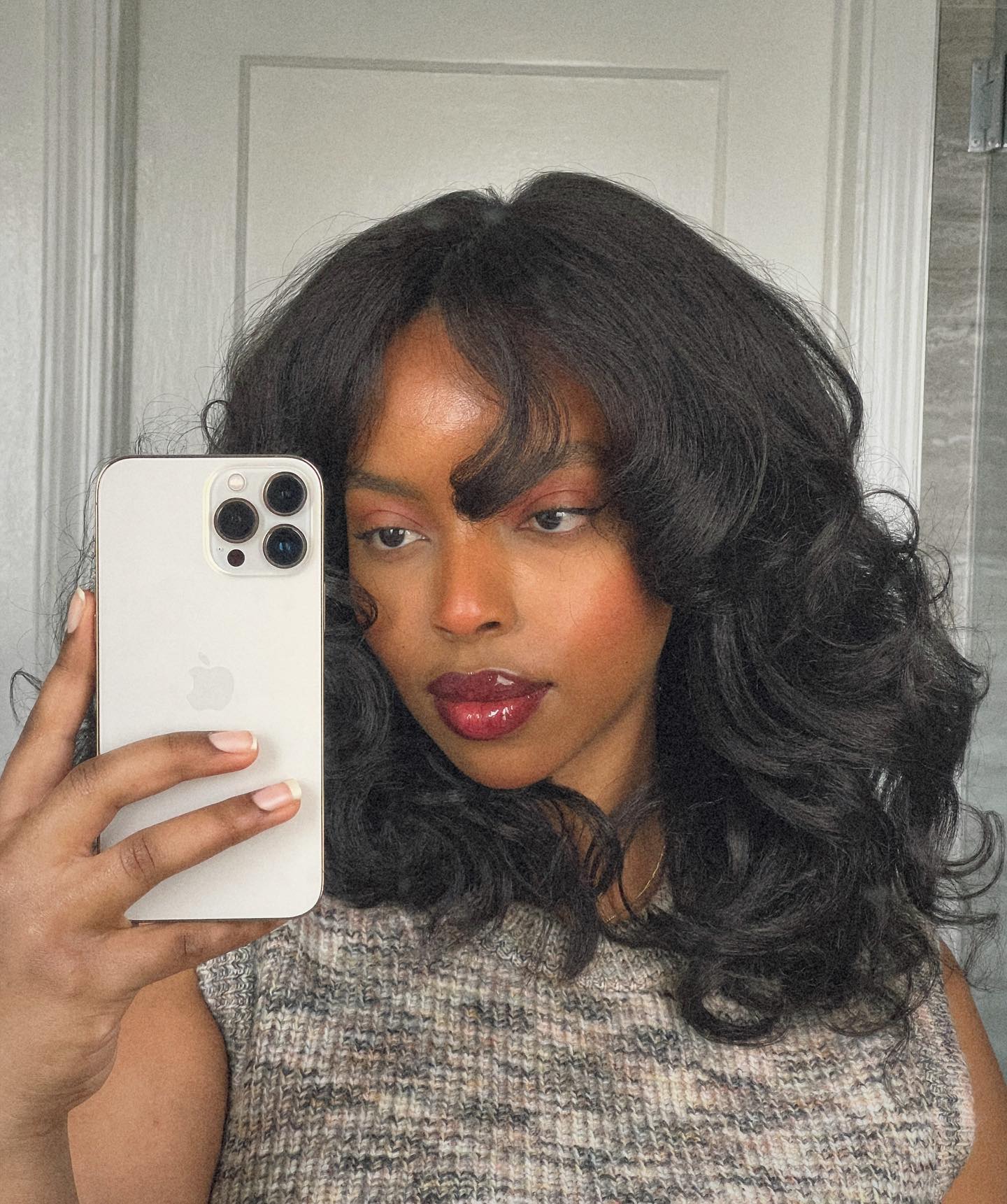 Shoulder-Length Waves With Curtain Bangs Shoulder-Length Waves With Curtain Bangs — Winter Haircuts for Black Women