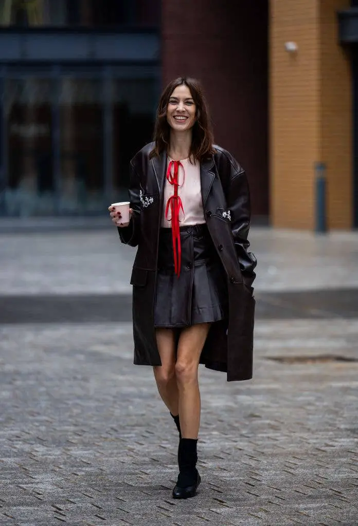 Layered Textures: Pleated Mini Under Leather Coat Layered Textures: Pleated Mini Under Leather Coat — Leather Skirt Outfits