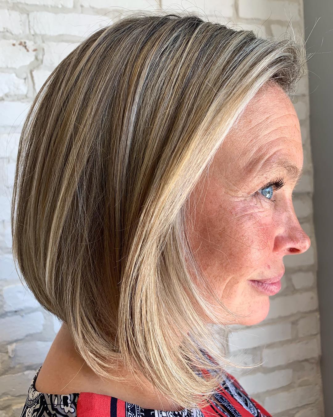 Sleek Platinum Blonde Bob Sleek Platinum Blonde Bob — Winter Hair Colors for Women Over 60