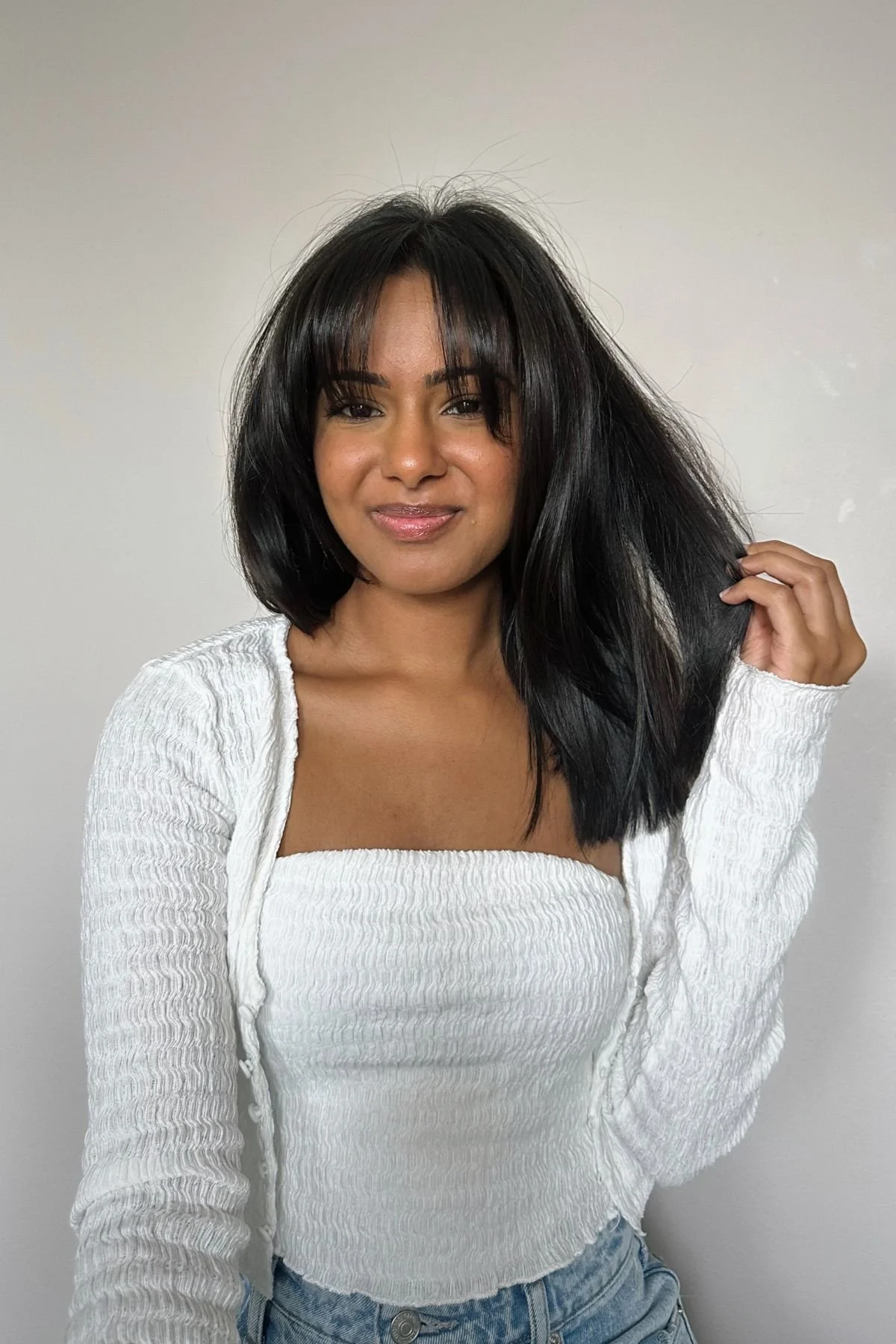Wavy Dark Hair with Face-Framing Layers and a Turtleneck Wavy Dark Hair with Face-Framing Layers and a Turtleneck — Trendy Haircuts for Women