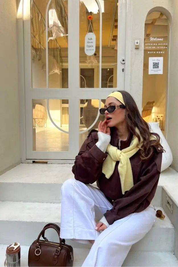 Long Beige Trench Coat Over Grey Turtleneck and Cream Trousers Long Beige Trench Coat Over Grey Turtleneck and Cream Trousers — Winter Brunch Outfits