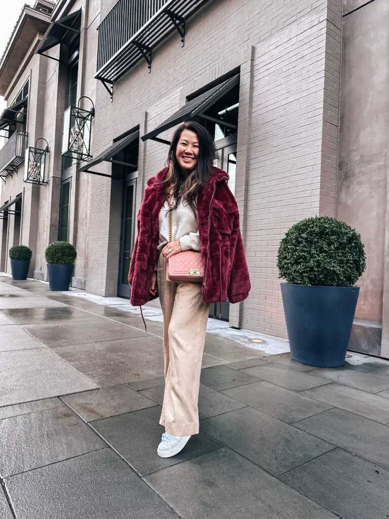 Burgundy Faux Fur Jacket Over Cream Sweater and Beige Pants — Neutral Winter Outfits