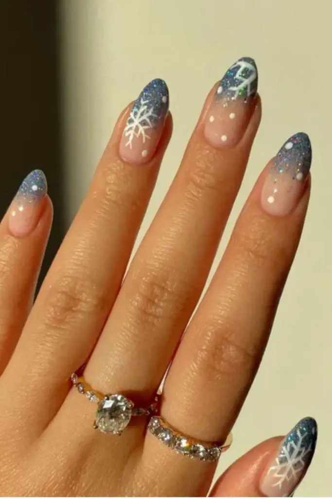 Nude Sheer with Blue Glitter Snowflake Art Nude Sheer with Blue Glitter Snowflake Art — Winter Nail Colors for Women Over 40