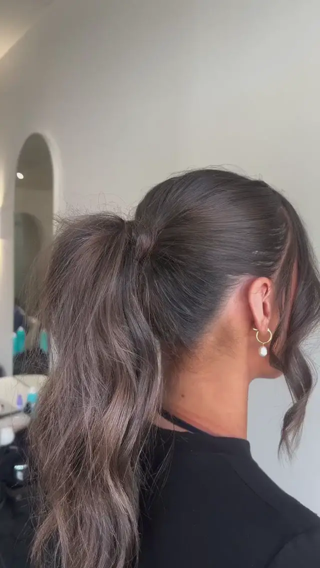 High Textured Ponytail With Face-Framing Strands High Textured Ponytail With Face-Framing Strands — Winter Date Night Hairstyles