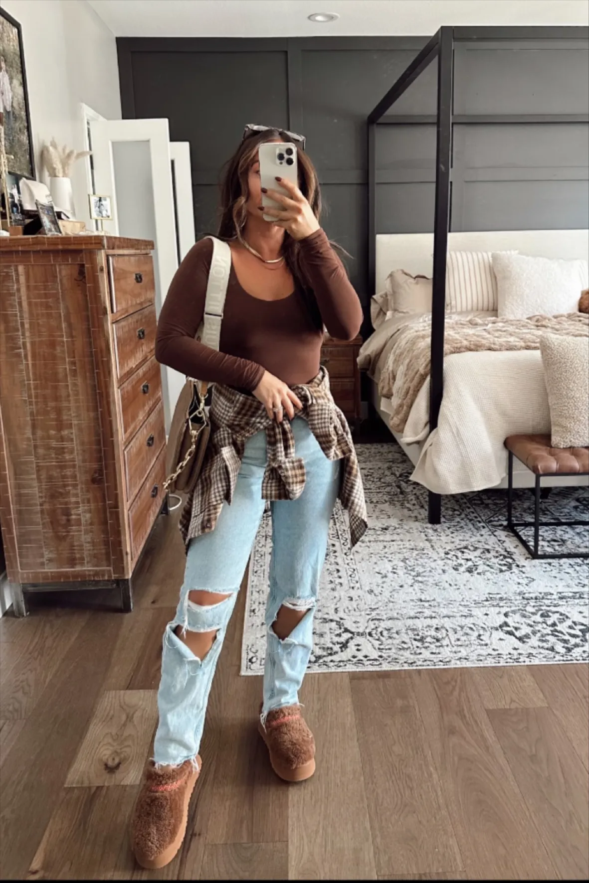 Streetwear Comfort: Brown Uggs with Ripped Jeans and Bodysuit Streetwear Comfort: Brown Uggs with Ripped Jeans and Bodysuit — Ugg Slippers Outfits