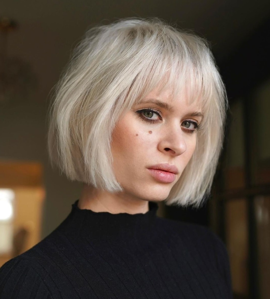 Sharp Platinum Bob With Blunt Bangs — Winter Haircuts for Thin Hair