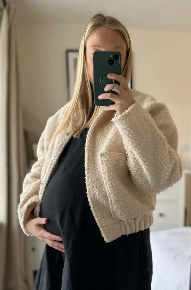 Teddy Fleece Jacket Over Black Maternity Dress Teddy Fleece Jacket Over Black Maternity Dress — Winter Maternity Outfits